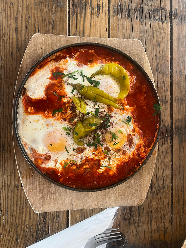 A colorful meal served on a rustic wooden table